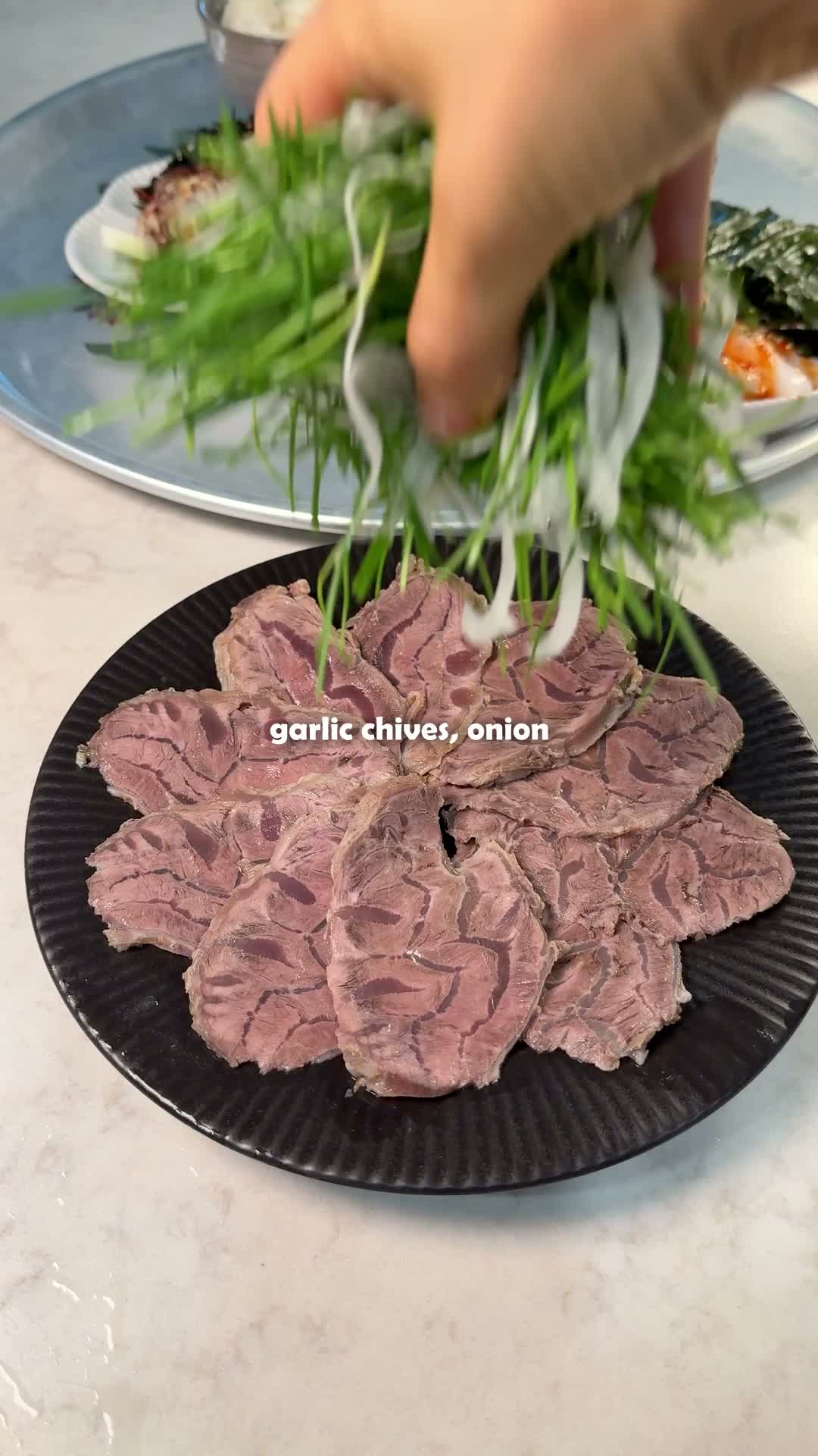 Cooled beef shank being thinly sliced