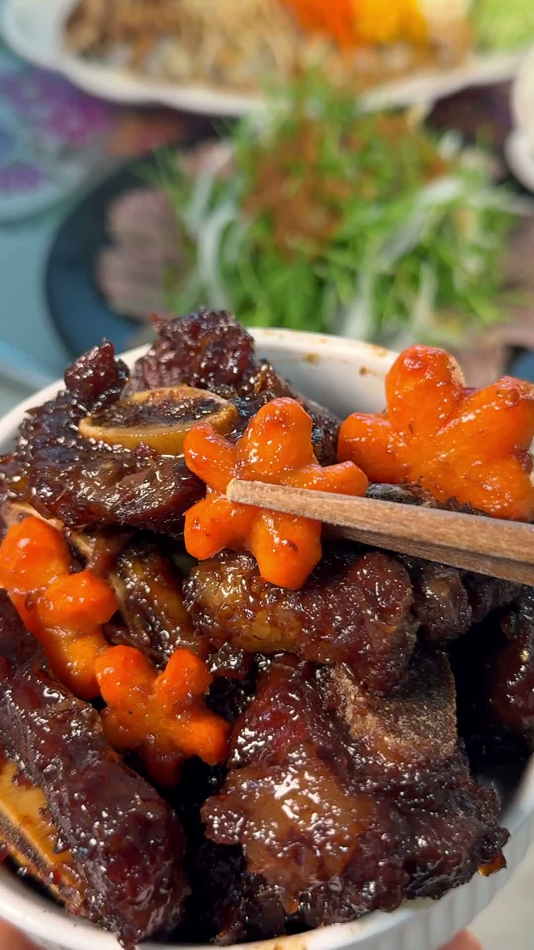 Braised short ribs transferred to a serving dish