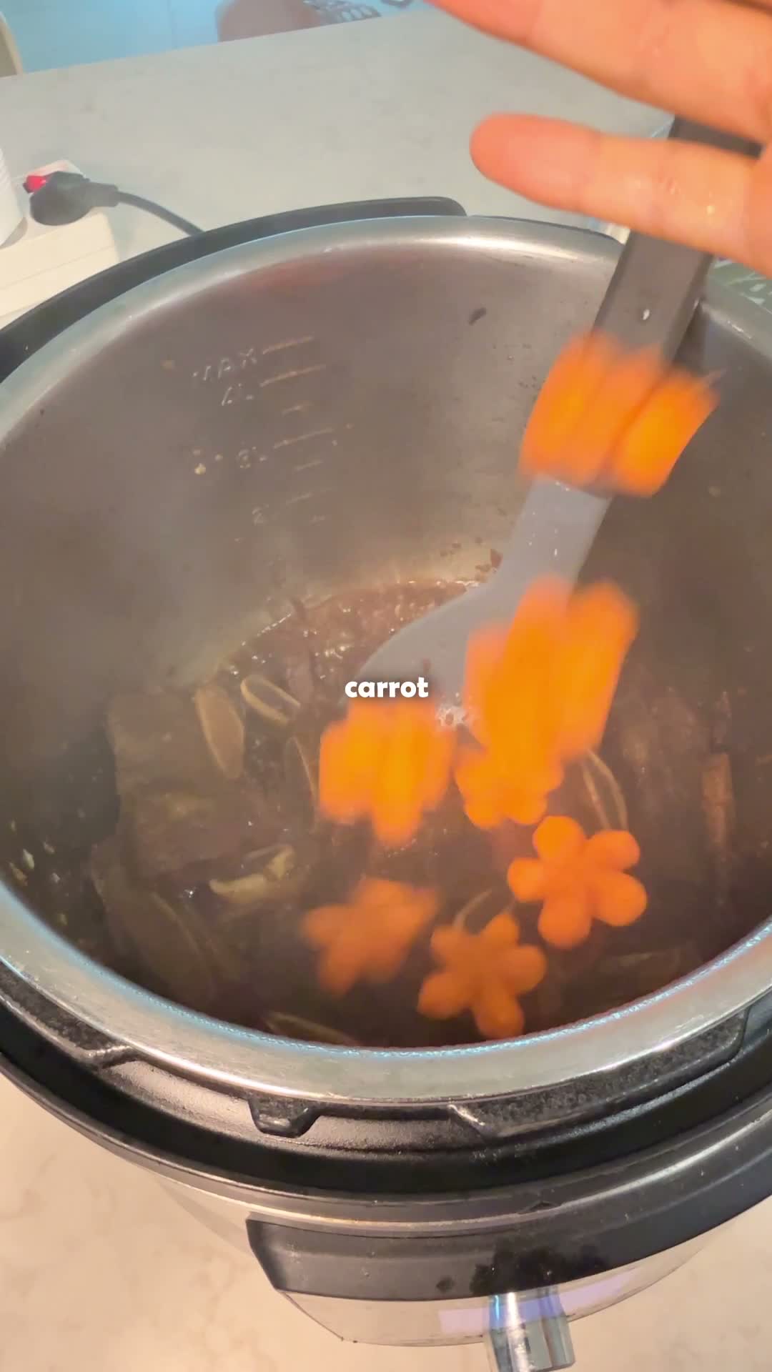 Carrots added to the pot to braise with the short ribs