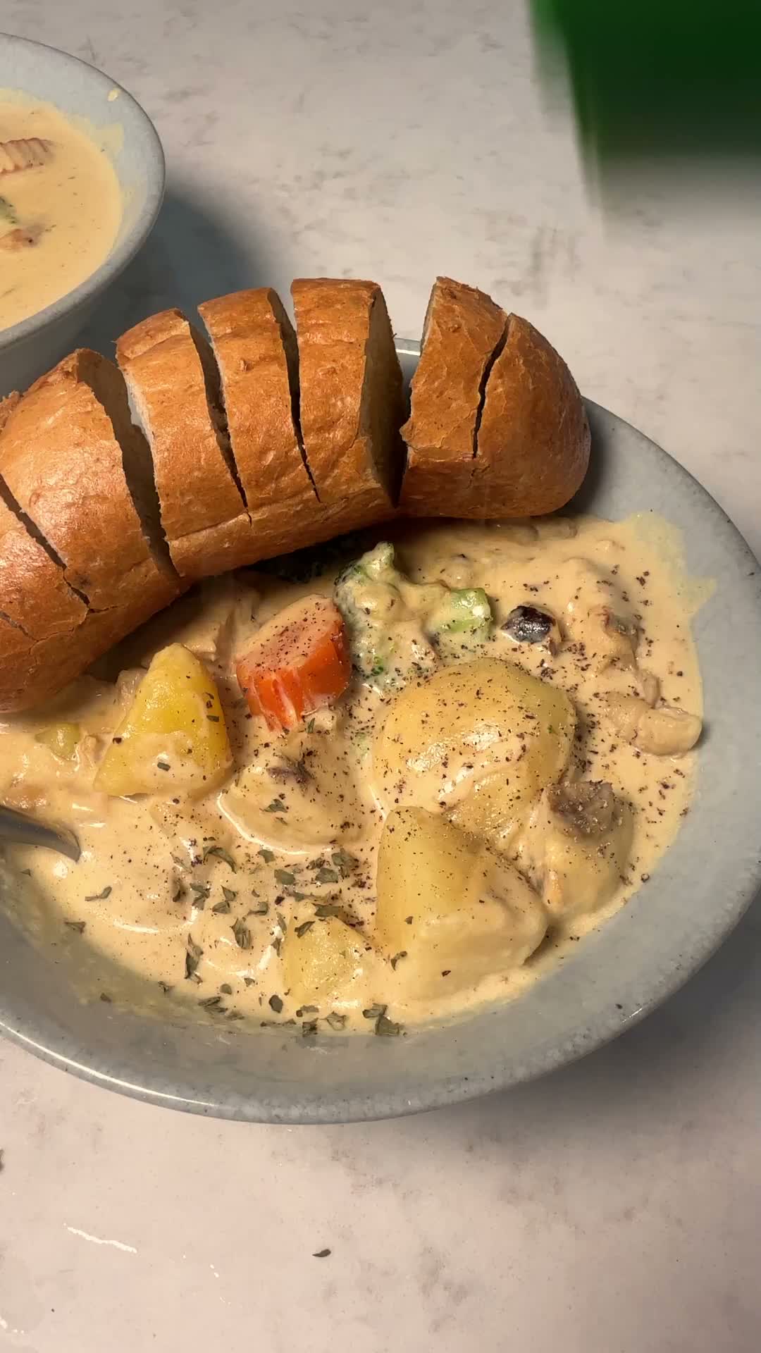 Bowl of Japanese cream stew served with sliced bread