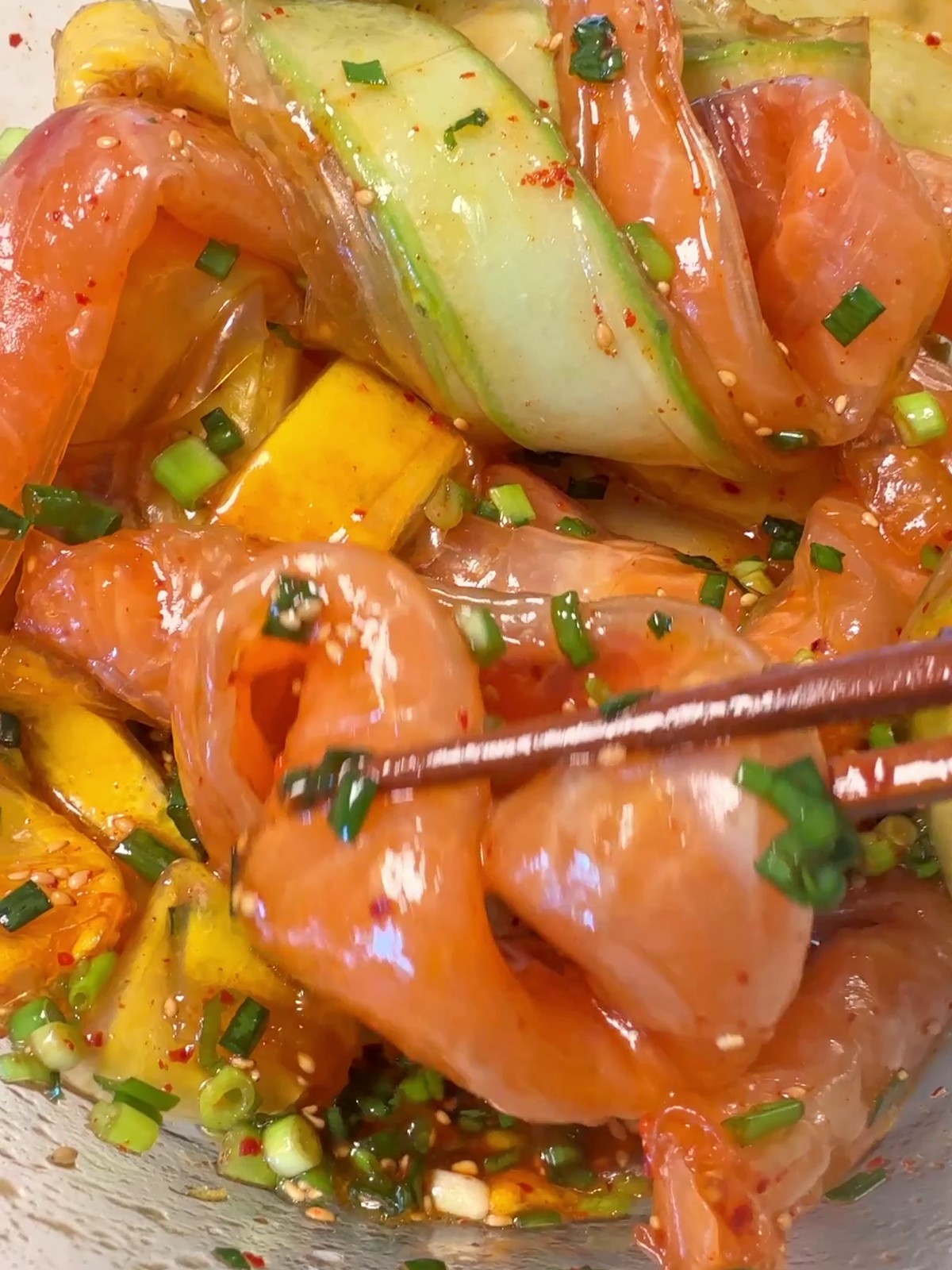 Crystal rice paper rolls with salmon, cucumber, and egg, dressed in tsuyu and gochugaru