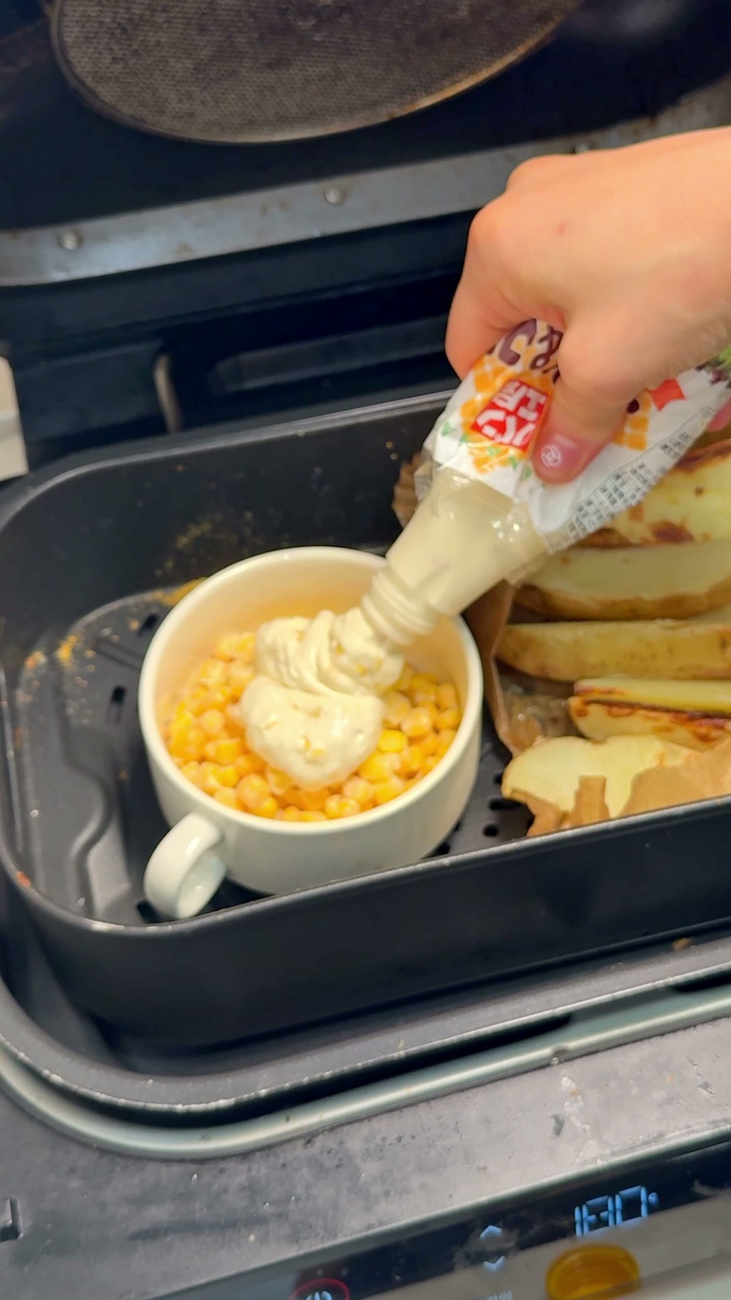Mixing sweet corn, mayonnaise, and cheese for the corn cheese dip