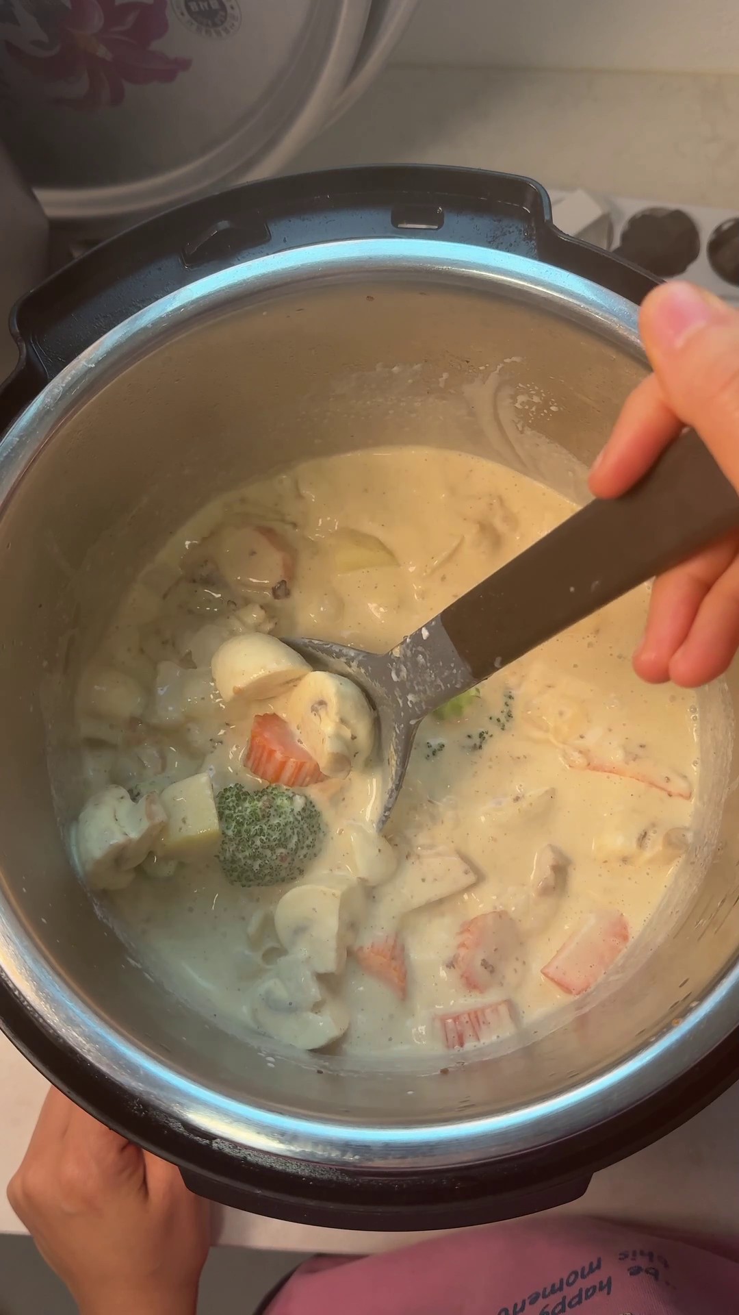 Two bowls of Japanese cream stew with chicken and vegetables, served with bread