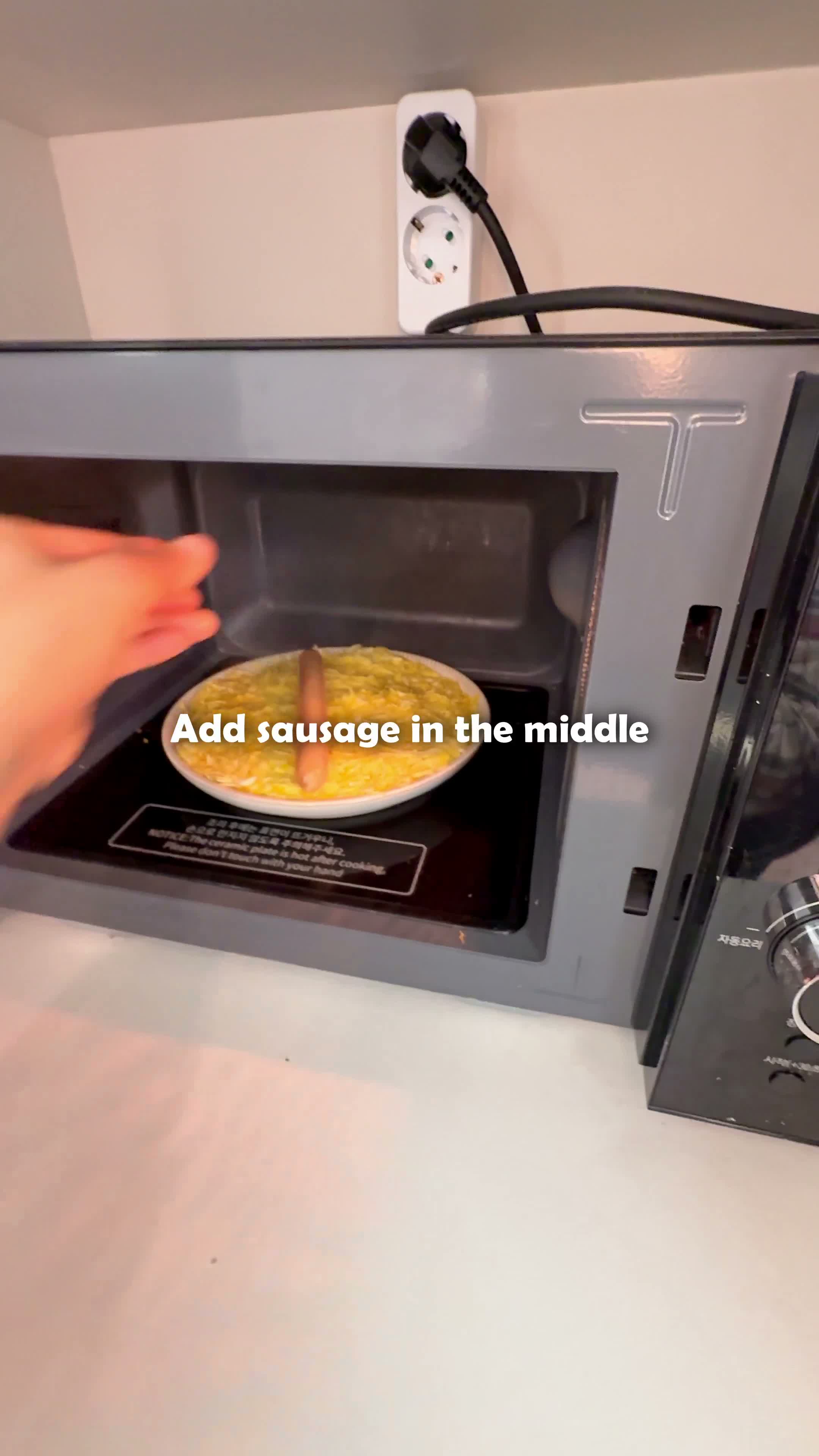 Sausage tucked into the egg mixture before microwaving
