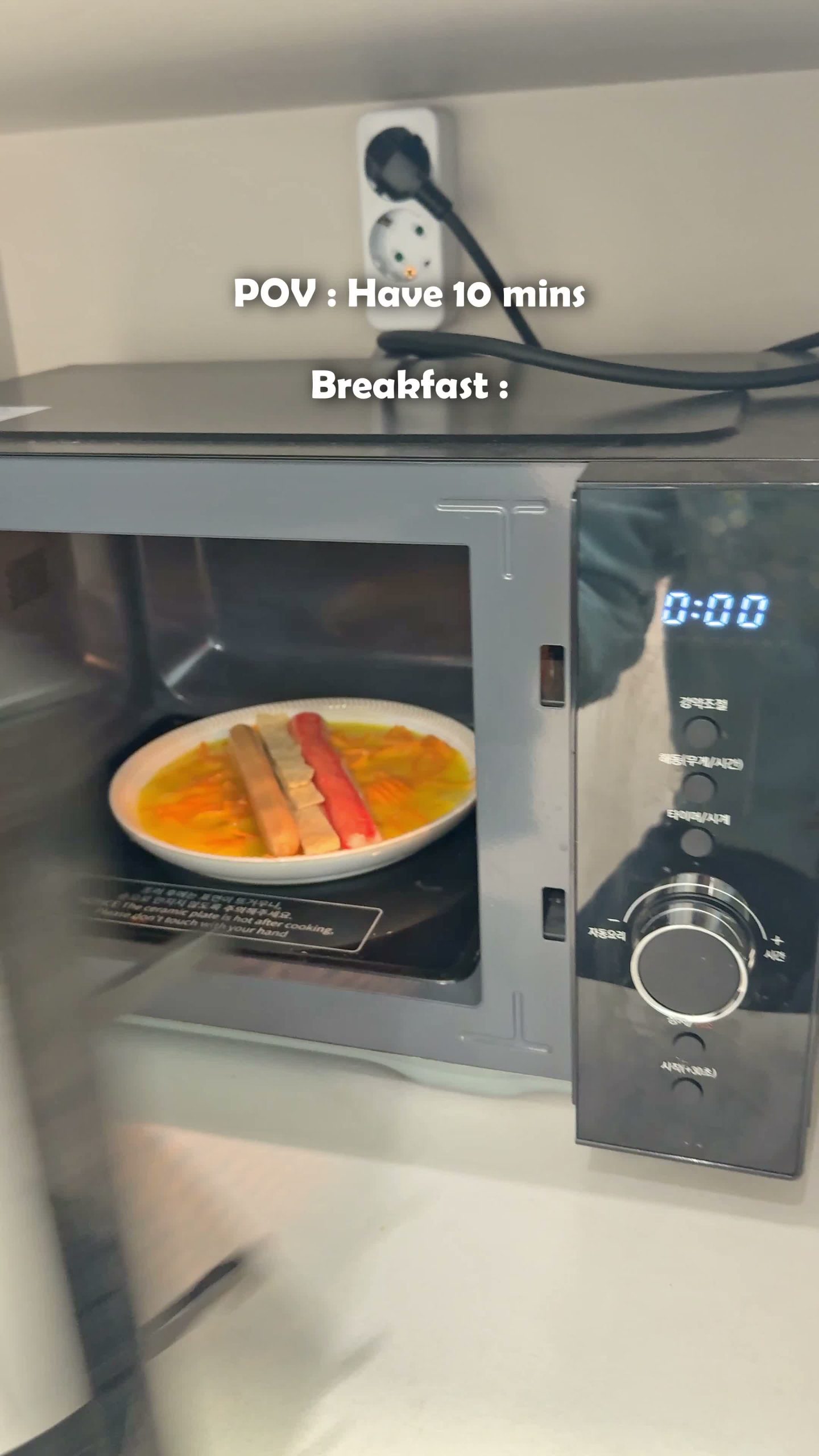 Egg and carrot mixture on a plate going into the microwave