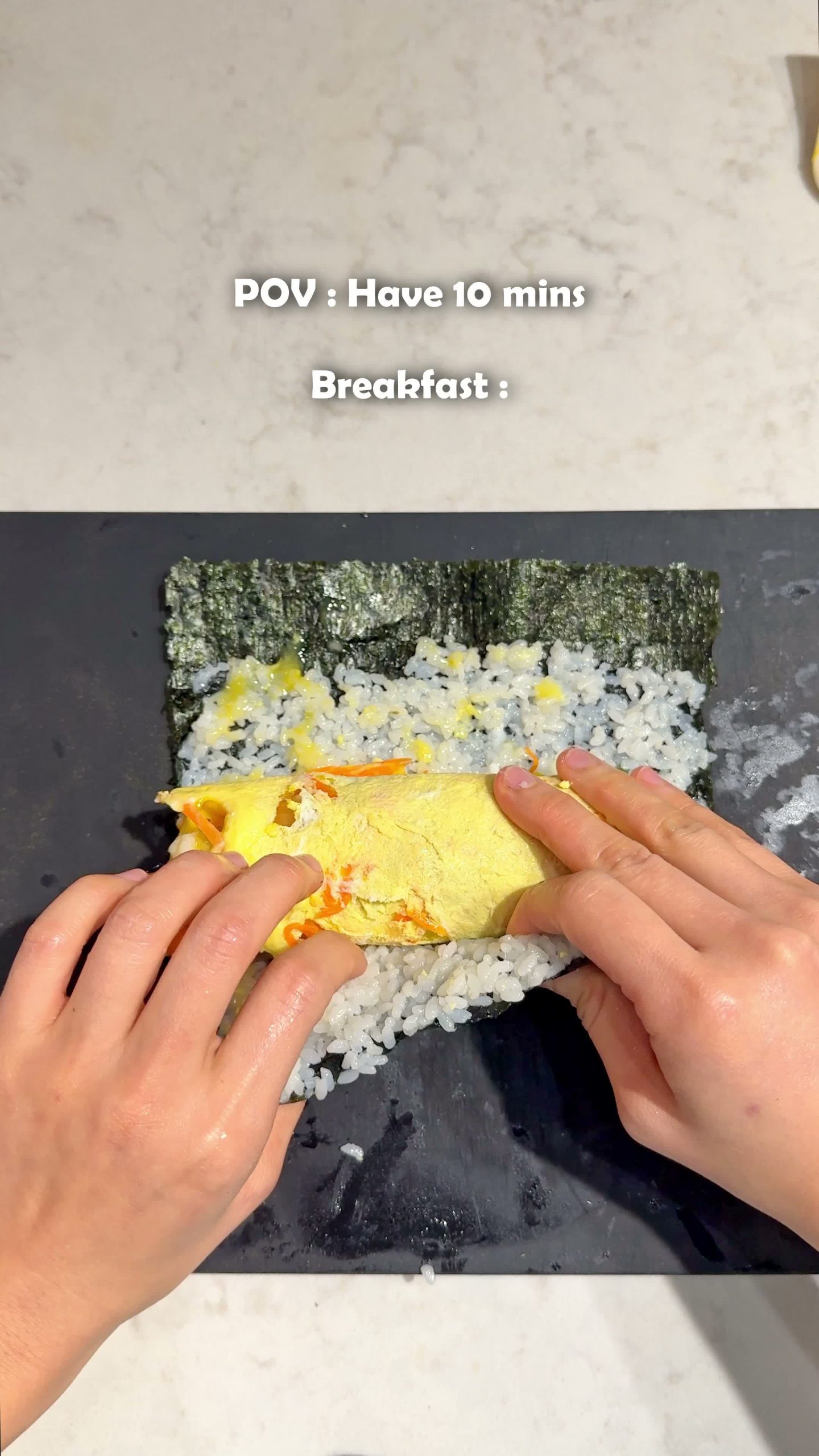 Rolling the kimbap filling up in a sheet of seaweed