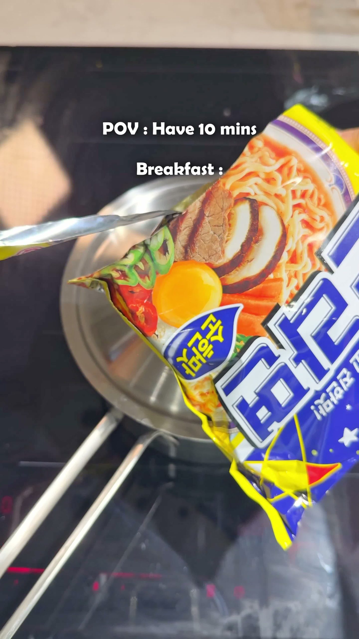 Cooking a bowl of ramyeon to serve alongside the kimbap