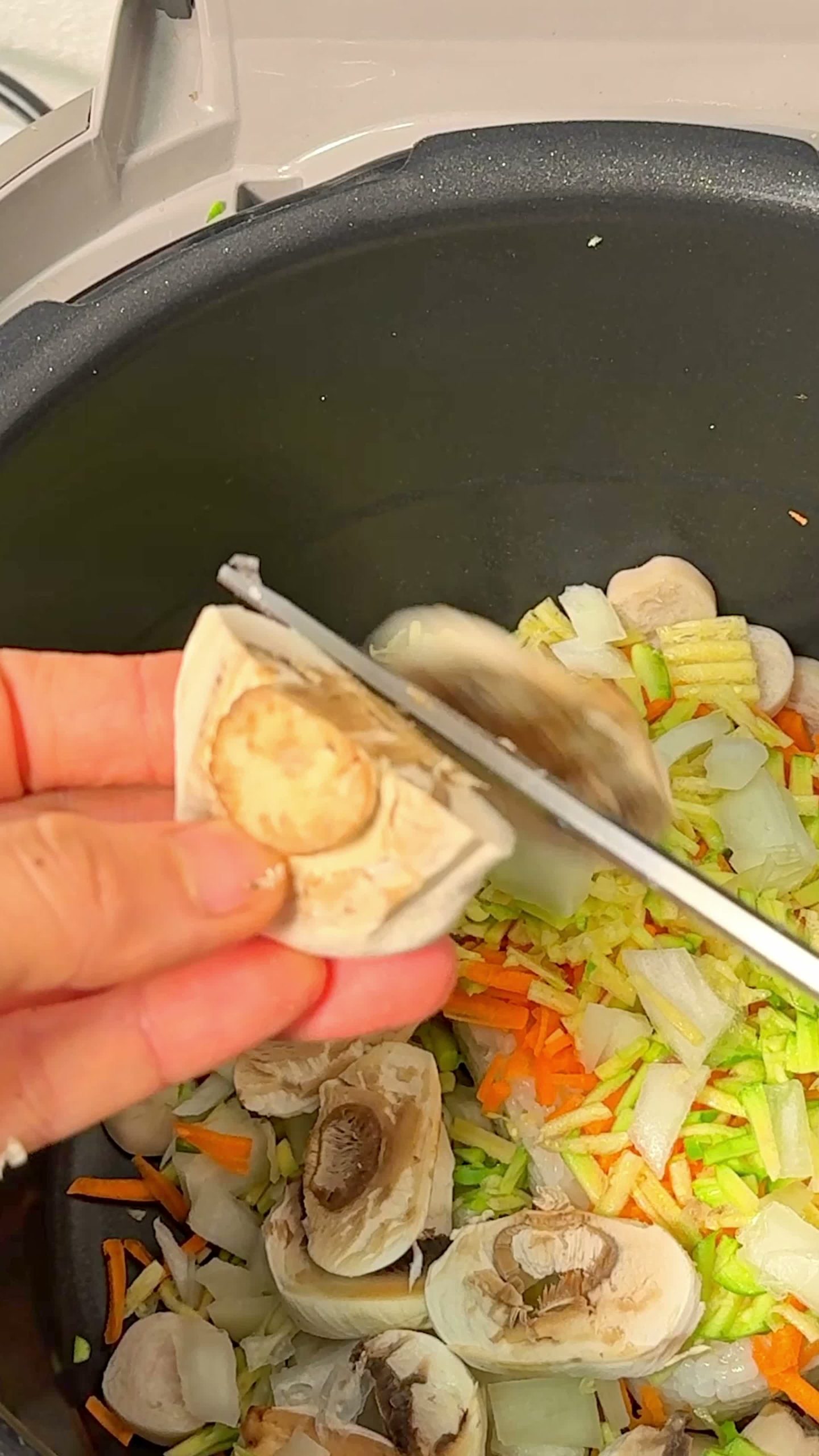 Leftover rice, sausage, veggies, and ketchup mixed in the pot