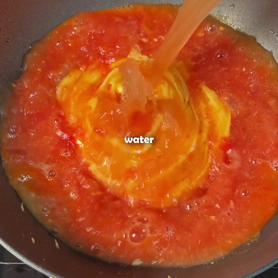Boiled tomato and water added to the pan