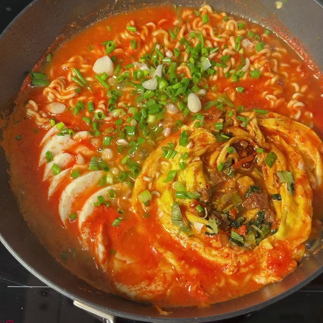 Finished ramen garnished with chopped green onions