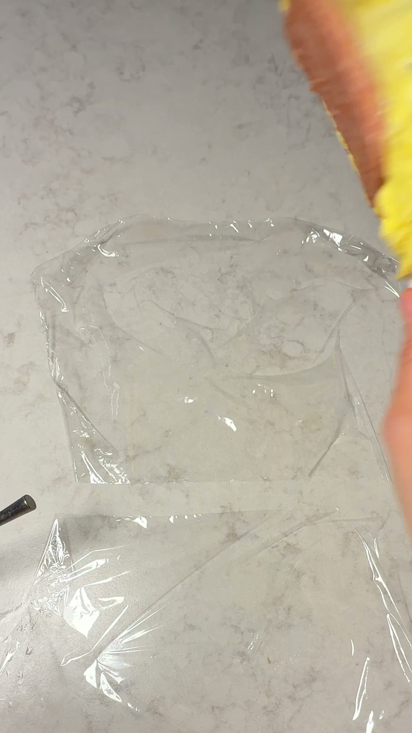Ketchup added to the cooked egg on a sheet of plastic wrap