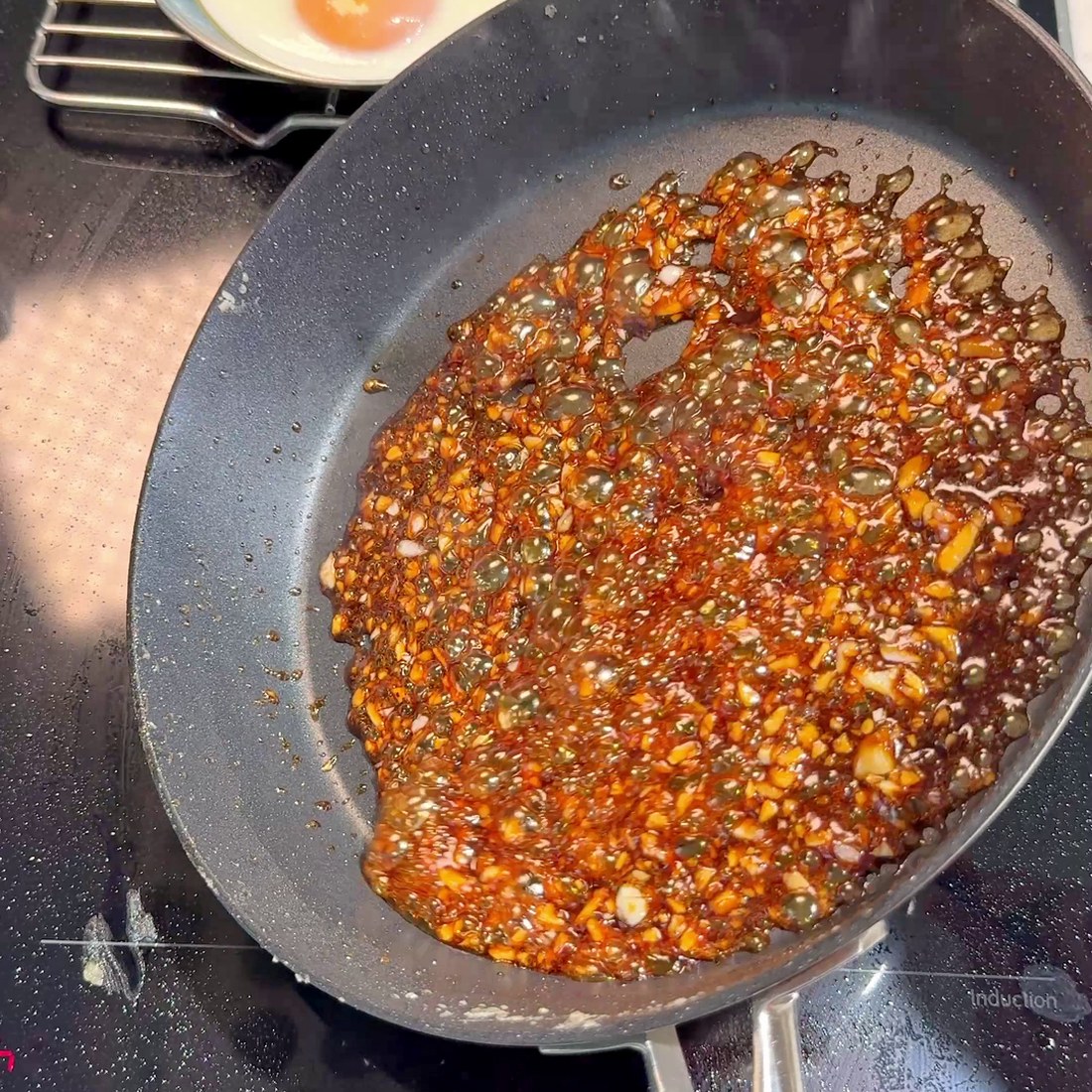 Garlic soy sauce glaze simmering in the pan