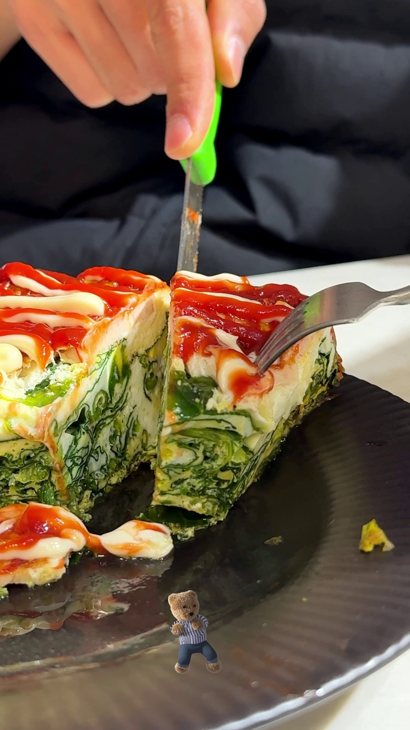 Whole spinach frittata with sausage in a round pan