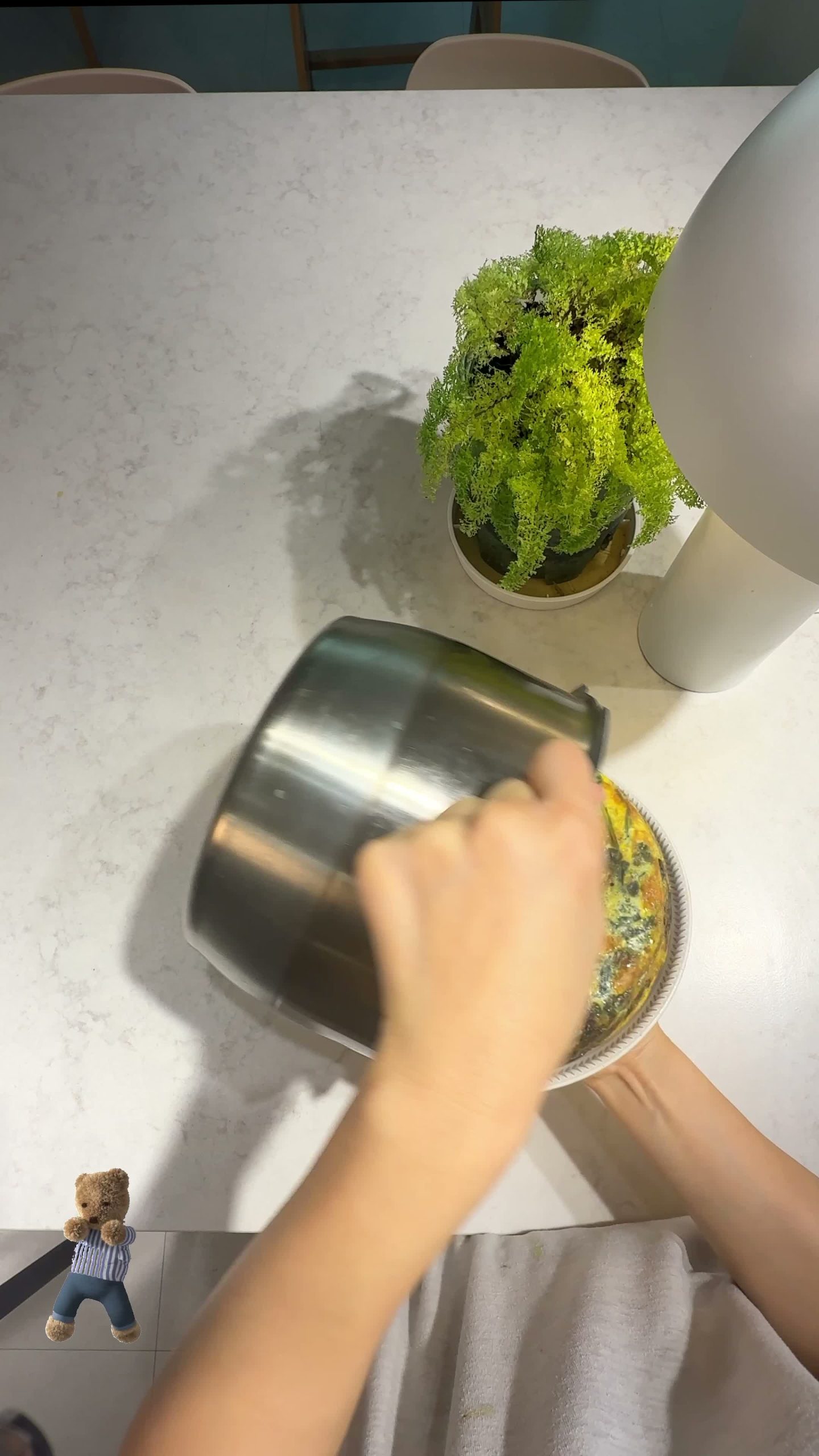 Flipping the frittata over into the pot