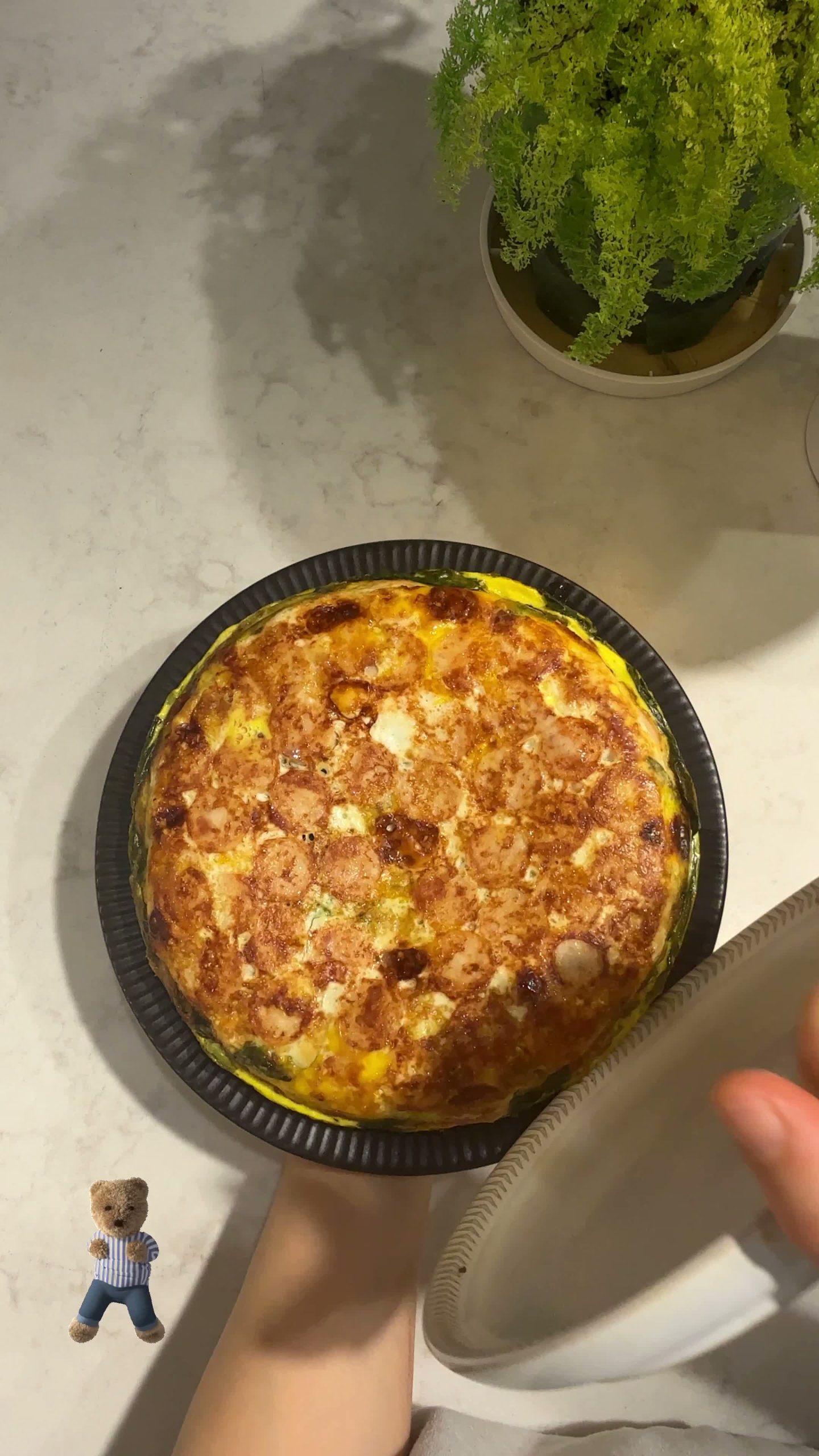 Frittata cooking on its other side