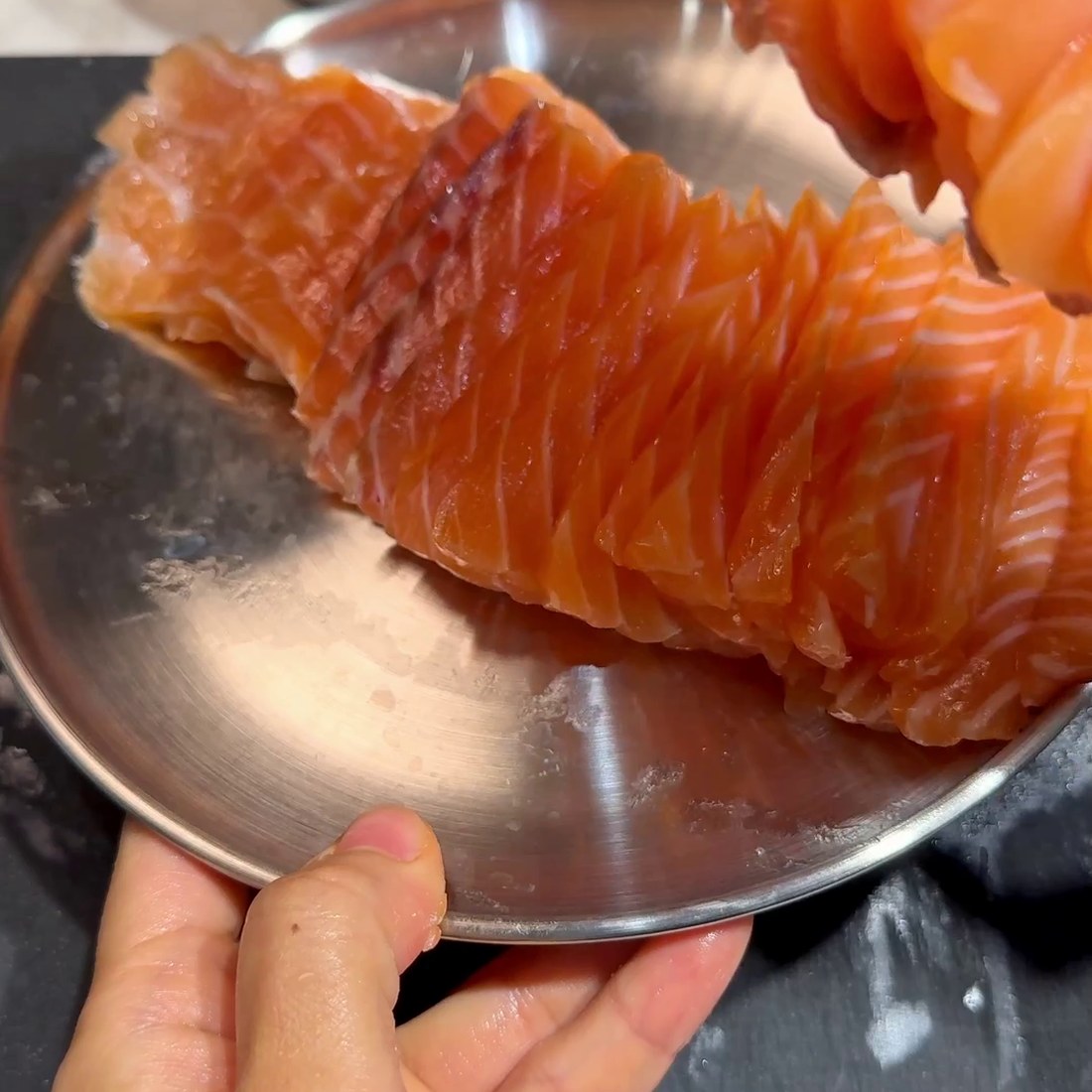 Cured salmon sliced into bite-sized pieces