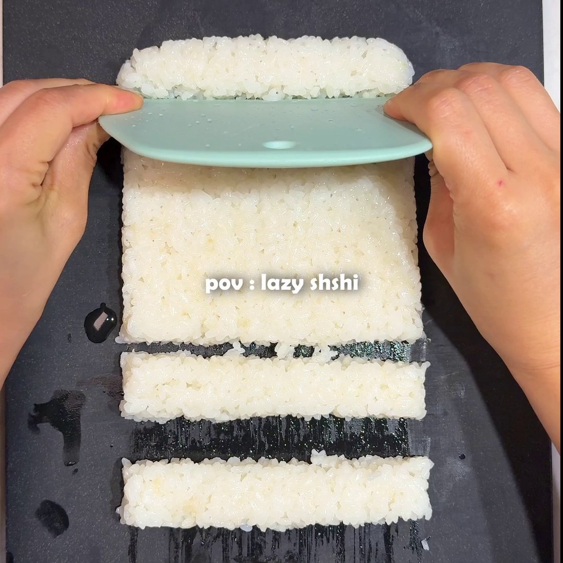Rice pressed into a container with sushi vinegar