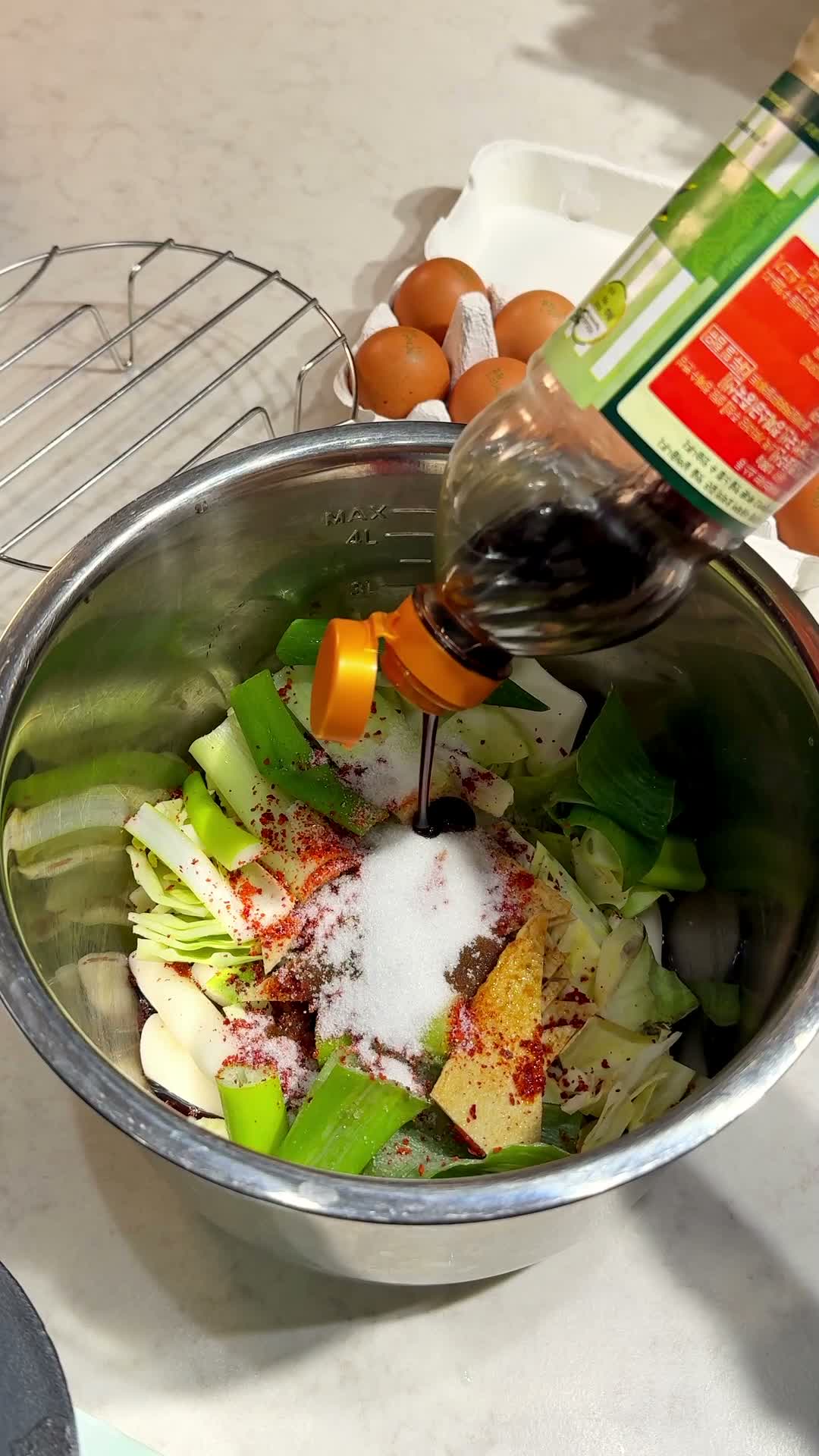 Rice cakes, cabbage, and seasonings mixed together in the pot