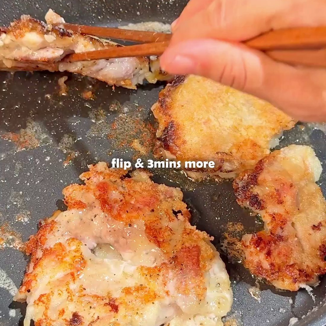 Chicken flipped in the pan to crisp the skin